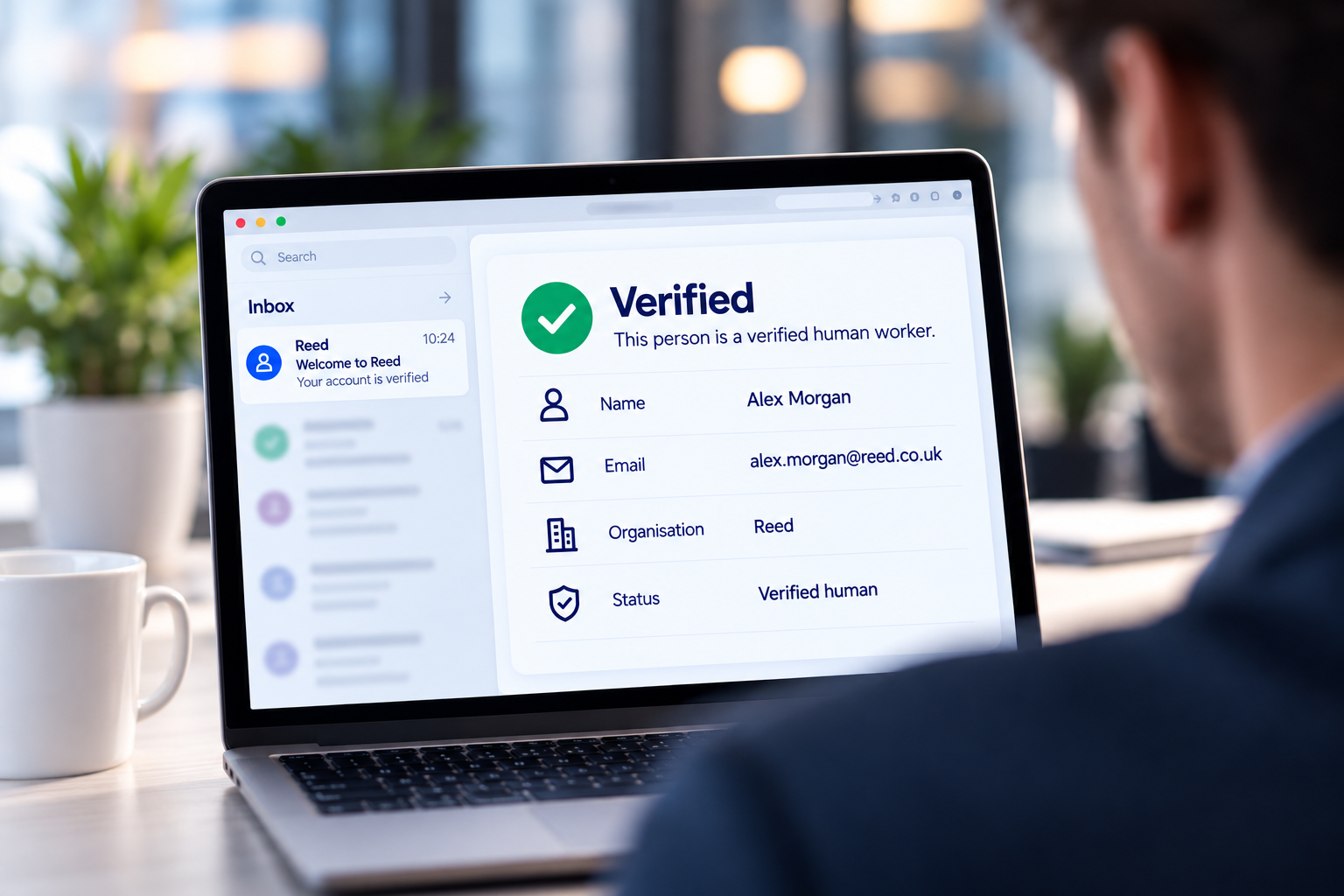A laptop showing a verified worker profile and email